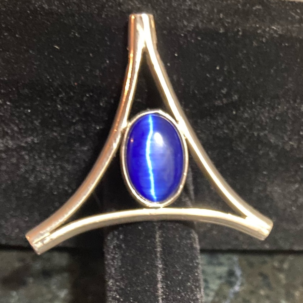 Triangular Sterling silver pendant.